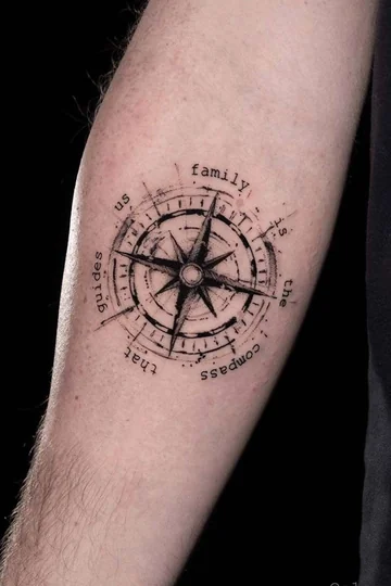 Black and grey fine line compass and quote tattoo design for men on upper