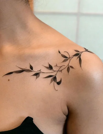 Fine Line vine floral tattoo design for women on shoulder