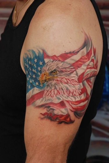 Realistic eagle and American flag tattoo design for men on upper arm
