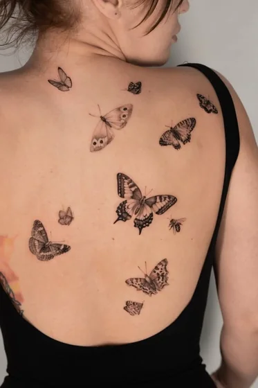 Realistic fine line butterfly and bee tattoo design for women on back
